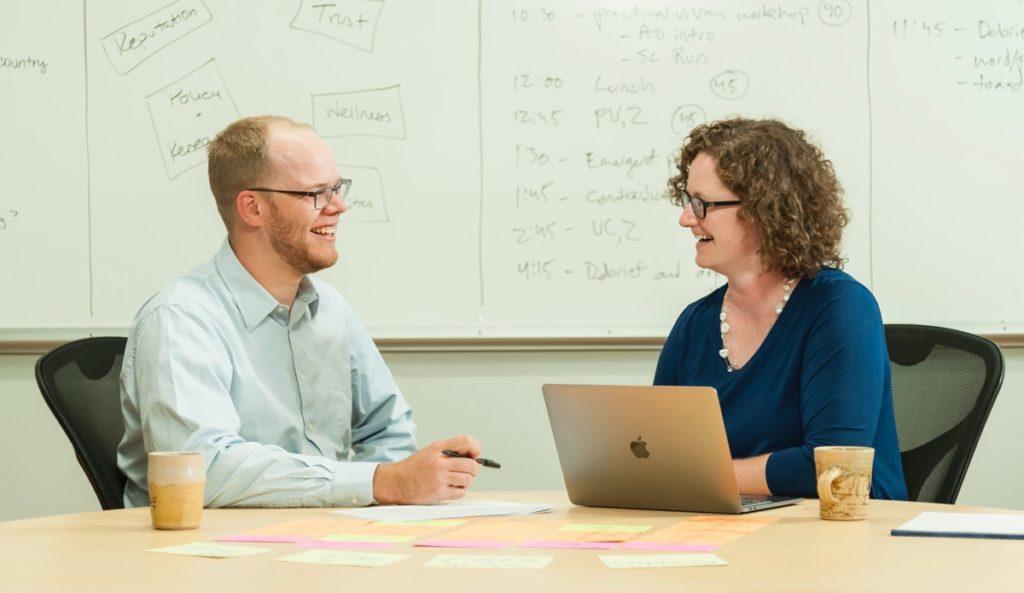 Two colleagues collaborating at a table